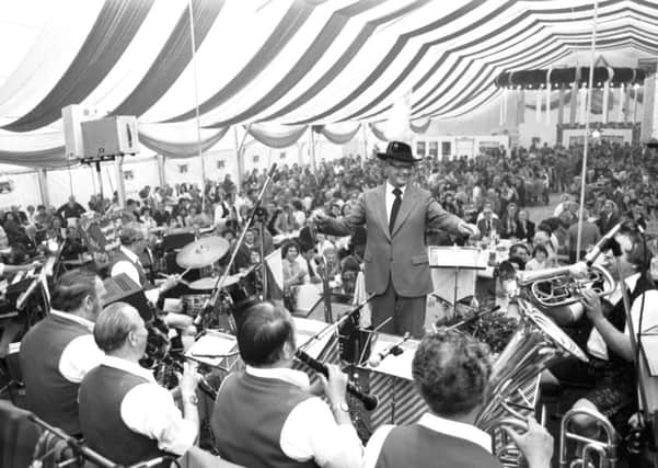 Lord Provost Kenneth Borthwick, in Tyrolean hat with feather, conducts the band at the Munich Beer Festival in Princes Street gardens, July 1979, commemorating 50 years of Edinburgh being twinned with Munich.