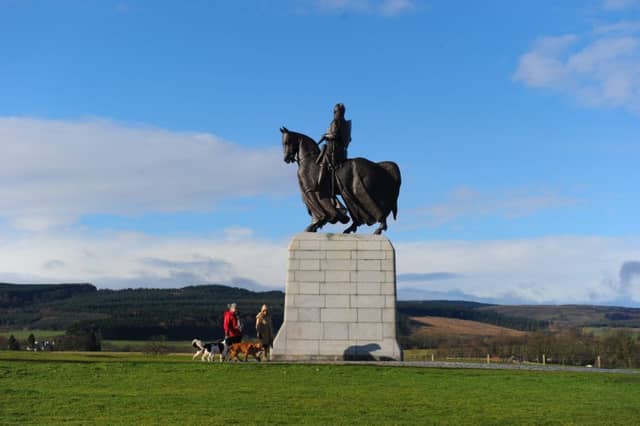 The new Battle of Bannockburn Visitor Centre at Bannockburn. Monument to King Robert the Bruce as a rainbow appears. Picture Robert Perry The Scotsman 20th Feb 2014