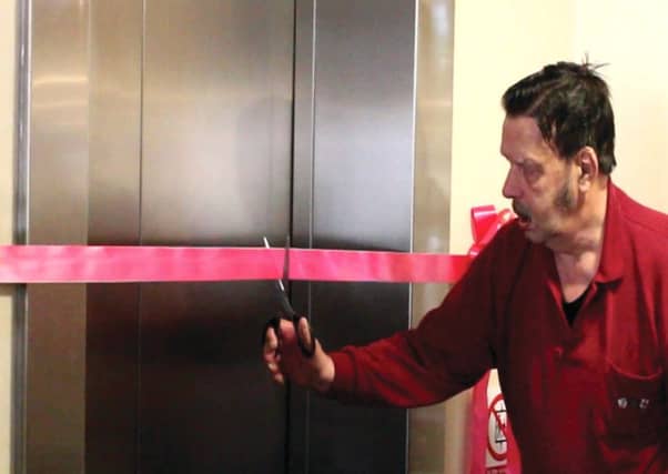 Mike Cavanagh cuts the ribbon for the new home life. Picture: Contributed