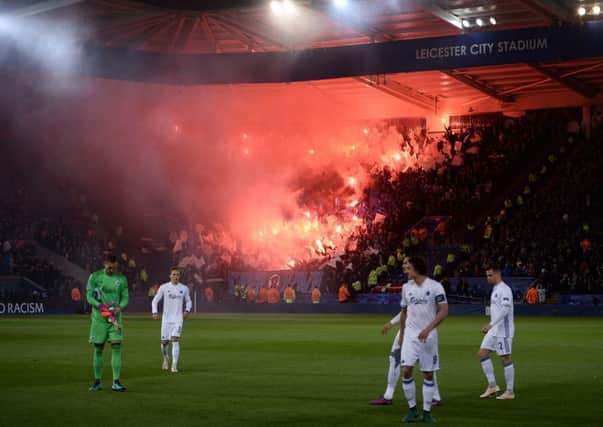 Copenhagen players react as their fans light flares in the King Power stadium. Picture: AFP/Getty