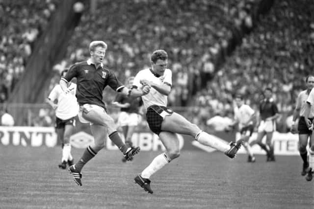 Scotland's Mo Johnston (Maurice Johnston) and Terry Butcher (playing for England)  clash during a Scotland v England match.