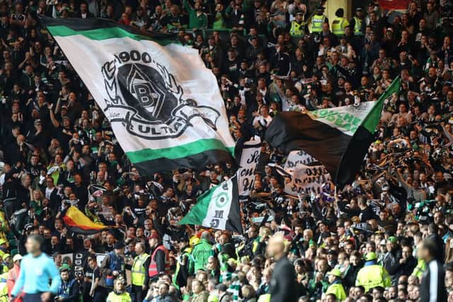 The Borussia Monchengladbach fans lit up Celtic Park. Picture: PA