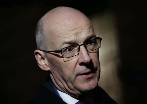 Scottish Finance Secretary John Swinney during media interviews after his meeting at the Treasury, London.  PRESS ASSOCIATION Photo. Picture date: Monday February 1, 2016. See PA story POLITICS Devolution. Photo credit should read: Yui Mok/PA Wire