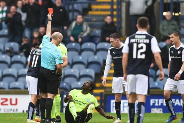 An incredulous Marvin Bartley is shown a straight red card against Raith Rovers. Picture: SNS