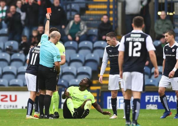 An incredulous Marvin Bartley is shown a straight red card against Raith Rovers. Picture: SNS