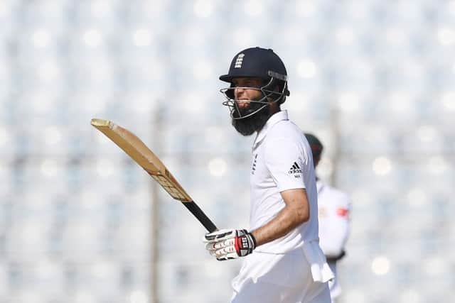 England's Moeen Ali celebrates after scoring his half-century. Picture: AFP