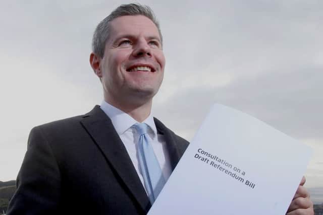 Constitution Minister Derek Mackay holds a copy of the Draft Referendum Bill. Gordon Terris/PA Wire