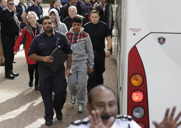 The UK has allowed entry to just 300 fleeing migrants, compared to Germanys offer of a home to 600,000. Picture: AP