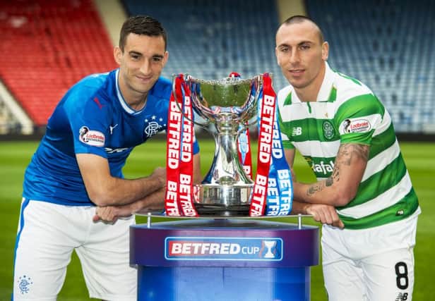 Rangers captain Lee Wallace (L) and Celtic captain Scott Brown (R) ahead of this weekend's semi-final. Picture: SNS