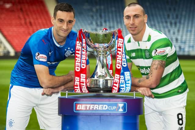 Rangers captain Lee Wallace (L) and Celtic captain Scott Brown (R) ahead of this weekend's semi-final. Picture: SNS