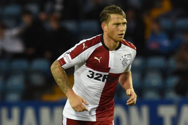Joe Garner is happy to be learning a new way to play football at Ibrox