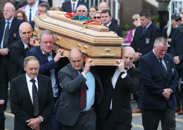 Former Munster players (l to r) John Langford, Mick Galwey, Peter Clohessy and Keith Wood carry Anthony Foleys coffin from St Flannans Church, Killaloe, Co. Clare yesterday. Picture: Brian Lawless/PA Wire