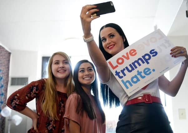 Pop star Katy Perry takes a selfie for fans as she campaigns for Hillary Clinton in Nevada at the weekend. Picture: Getty