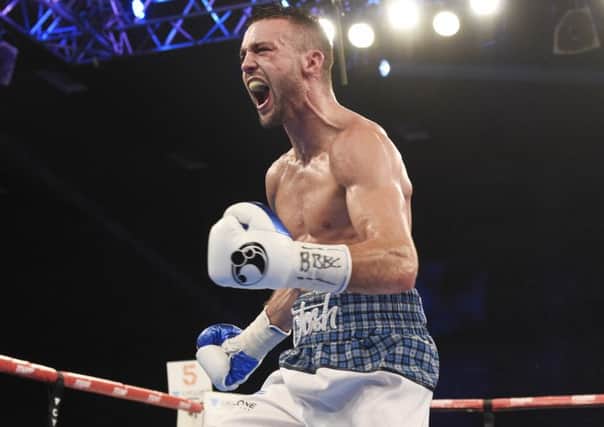 Josh Taylor celebrates lifting the Commonwealth belt after beating Dave Ryan. Photograph: Ian Rutherford
