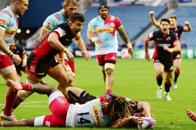 Marland Yarde is unable to stop Tom Brown from scoring what turned out to be Edinburghs winning try. Picture: SNS