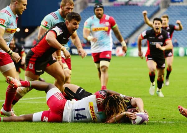 Marland Yarde is unable to stop Tom Brown from scoring what turned out to be Edinburghs winning try. Picture: SNS