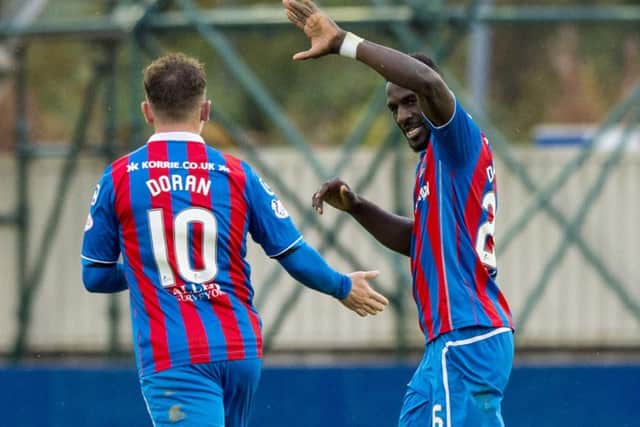 Inverness' Lonsana Doumbouya, right, celebrates scoring the equaliser against Kilmarnock. Picture: SNS/Sammy Turner