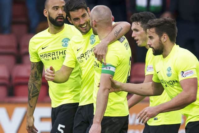 Hibs players celebrate Saturday's 3-1 Championship win at East End Park. Picture: SNS