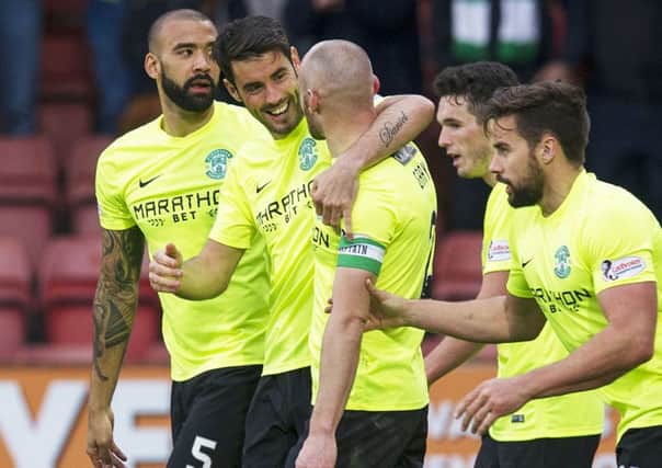Hibs players celebrate Saturday's 3-1 Championship win at East End Park. Picture: SNS