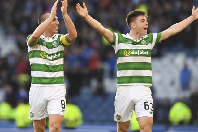 Scott Brown (left) and Kieran Tierney celebrate Celtic's victory. Picture: SNS