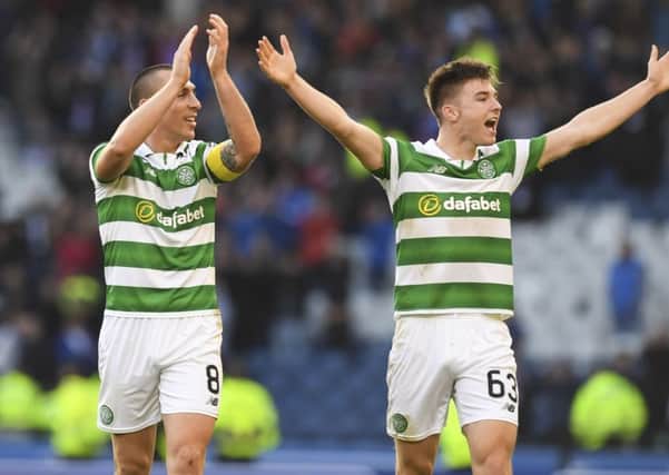 Scott Brown (left) and Kieran Tierney celebrate Celtic's victory. Picture: SNS
