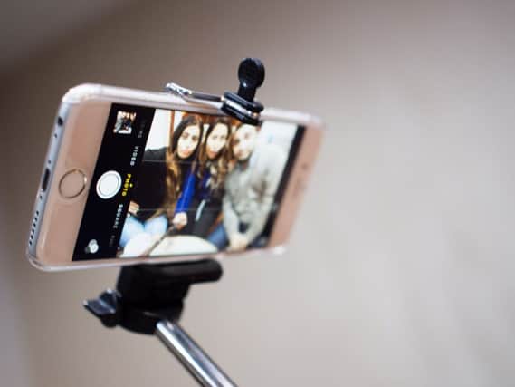 Selfie sticks, tablecloths and CD storage racks have fallen out of fashion, according to a report into a year in the life of the British shopper. Picture: Wikimedia