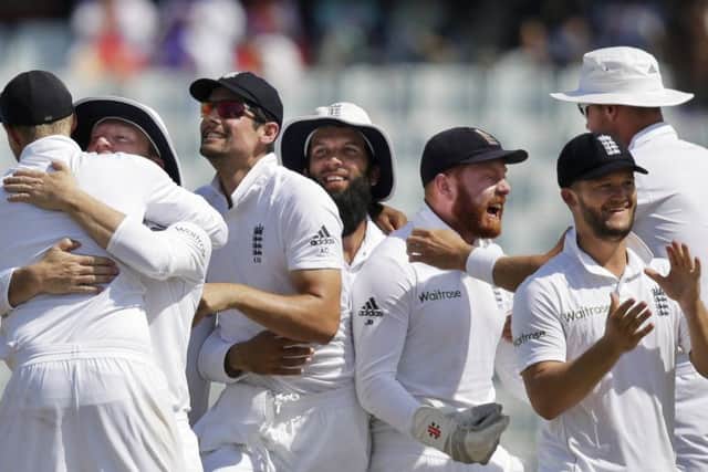 England captain Alastair Cook, third from left, and his team-mates celebrate their victory over Bangladesh. Picture: A M Ahad/AP