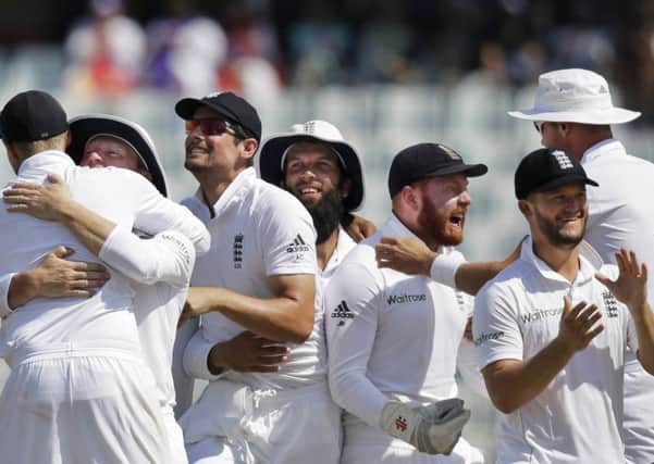 England captain Alastair Cook, third from left, and his team-mates celebrate their victory over Bangladesh. Picture: A M Ahad/AP