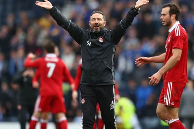 Derek McInnes salutes the 12,000-plus Aberdeen supporters after his sides Betfred Cup semi-final win over Morton at Hampden. Picture: Michael Steele/Getty Images