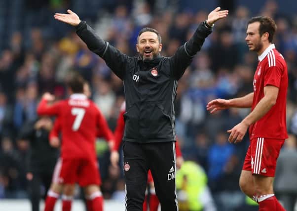 Derek McInnes salutes the 12,000-plus Aberdeen supporters after his sides Betfred Cup semi-final win over Morton at Hampden. Picture: Michael Steele/Getty Images