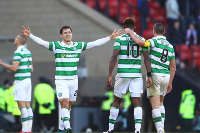 Erik Sviatchenko, left, celebrates at full-time with Moussa Dembele and Scott Brown, right. Picture: Getty