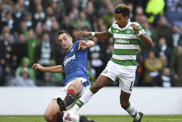 Celtic's Scott Sinclair, right, is tackled by Lee Wallace inside the penalty area at Hampden on Sunday.