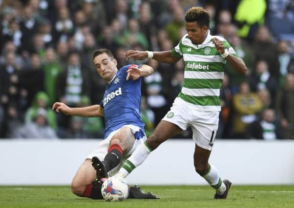 Celtic's Scott Sinclair, right, is tackled by Lee Wallace inside the penalty area at Hampden on Sunday.