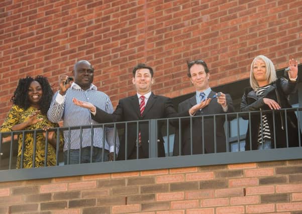Tenants Deba Odoko, Kingsley Umweni, Stephen Ritchie and Toniann Grady receive the keys to their new affordable homes in Pennywell from Councillor Cammy Day. Picture: Ian Georgeson