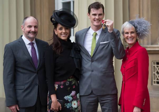 Jamie Murray with his wife Alejandra Gutierrez, mother Judy and father William after he received his Officer of the Order of the British Empire (OBE). Picture: Stefan Rousseau/Getty Images