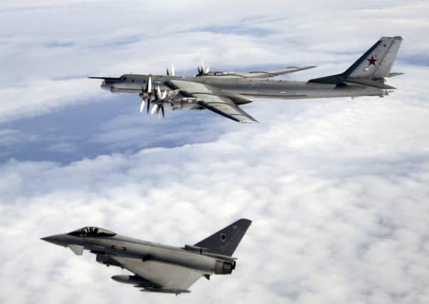 A  Typhoon F2  escorting a Russian Bear-H aircraft over the North Atlantic Ocean .

Picture: MoD