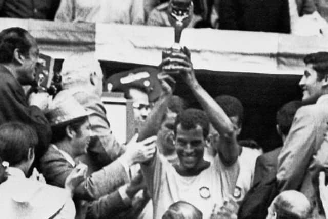 Brazil captain Carlos Alberto holds aloft the Jules Rimet trophy after Brazil defeated Italy 4-1 in the 1970 World Cup final. Picture: AFP/Getty Images