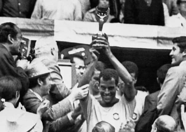 Brazil captain Carlos Alberto holds aloft the Jules Rimet trophy after Brazil defeated Italy 4-1 in the 1970 World Cup final. Picture: AFP/Getty Images