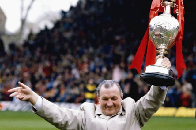 Liverpool manager Bob Paisley holds aloft the English First Division title in 1983. Picture: Mike Powell/Allsport/Getty Images