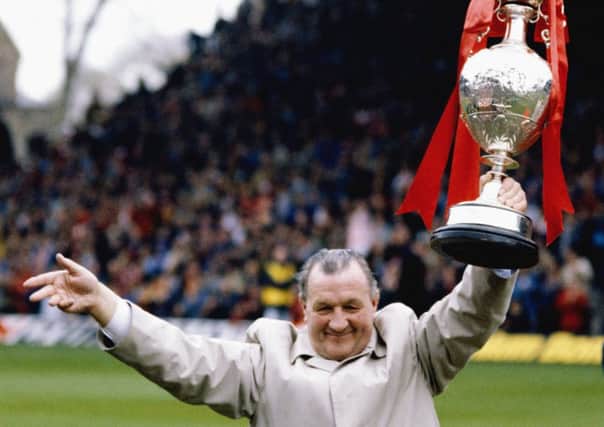 Liverpool manager Bob Paisley holds aloft the English First Division title in 1983. Picture: Mike Powell/Allsport/Getty Images
