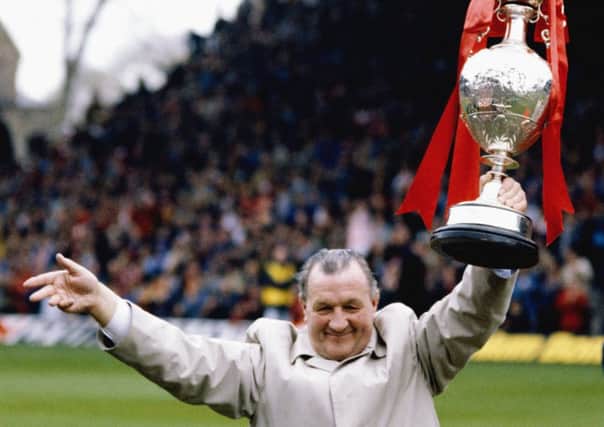 Liverpool manager Bob Paisley holds aloft the English First Division title in 1983. Picture:  Mike Powell/Allsport/Getty Images