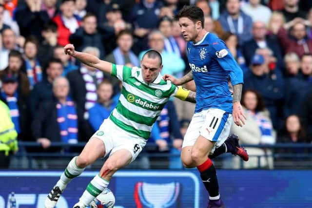 Scott Brown dominated the Rangers midfield on Sunday, including Josh Windass, right. Picture: PA