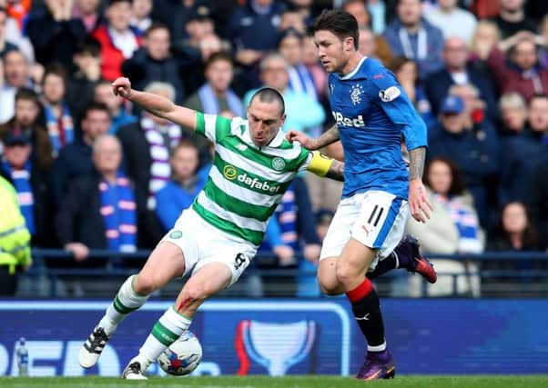 Scott Brown dominated the Rangers midfield on Sunday, including Josh Windass, right. Picture: PA