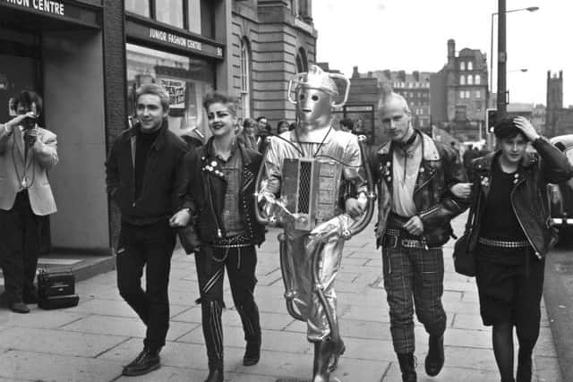 Punks walk along Lothian Road, Edinburgh, to publicise a Dr Who exhibition in 1983. The punk scene widely embraced tartan. Picture: Joe Steele/TSPL