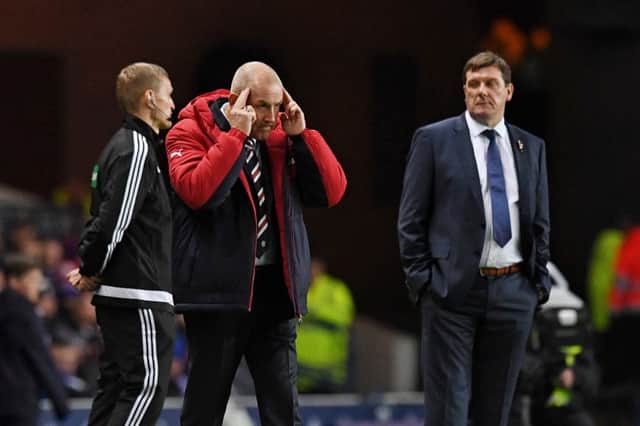 Mark Warburton issues instructions as Tommy Wright watches on from the sidelines. Picture: SNS