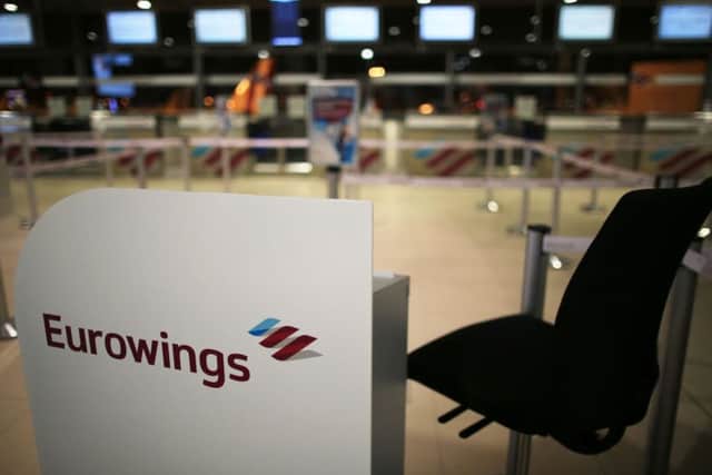 The entrance to a counter of airline Eurowings is pictured at the airport Cologne/Bonn in Cologne, western Germany. AFP PHOTO / dpa / Oliver Berg / Germany OUTOLIVER BERG/AFP/Getty Images