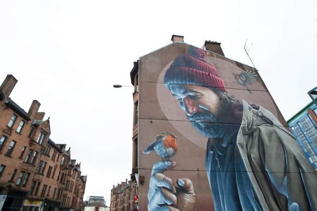 The trail takes in some the city's most famous murals. Picture: John Devlin
