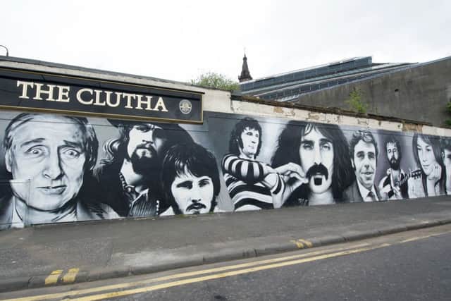 The Clutha Vaults mural of famous customers being painted by Bobby McNamara aka Rogue-One. Picture: John Devlin