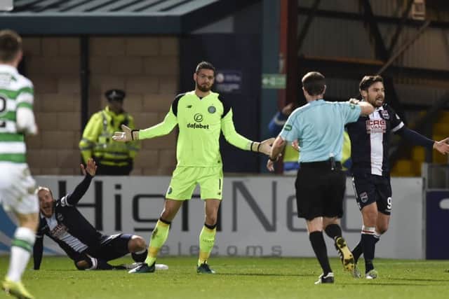 Alan Muir runs to book Craig Gordon after the Celtic goalkeeper took out Liam Boyce. Picture: SNS