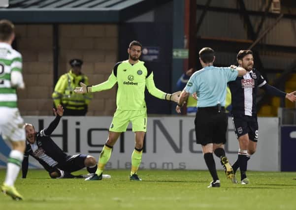 Alan Muir runs to book Craig Gordon after the Celtic goalkeeper took out Liam Boyce. Picture: SNS